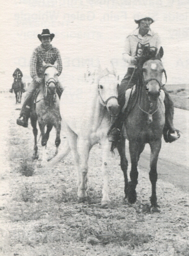 Dr. Marian Molthan, of Laveen, Arizona, rides Spring Ledge Bridgette (owned by Dorothy Lyons at the time) and ponies her own mare, OH Heather Buck's Roan, in Wyoming during The Great American Horse Race in the summer of 1976.