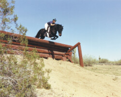 Lynfields Kiltuck, a black Connemara pony stallion, practices a drop fence in 1990 at Andrew Popiel's course in Arizona. Lynfields Kiltuck, a black Connemara pony stallion, practices a drop fence in 1990 at Andrew Popiel's course in Arizona.