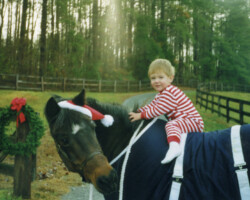 Round Robin's Easter Bonnet with a child in the 1990s. Round Robin's Easter Bonnet with a child in the 1990s.