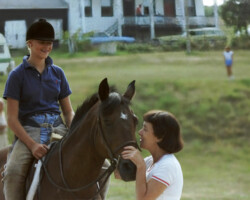 Round Robin's Easter Bonnet with a rider aboard and Joan McKenna Sr. on the ground at a horse show at Wessels Stables in the early 1980s in St. Louis County. Round Robin's Easter Bonnet with a rider aboard and Joan McKenna Sr. on the ground at a horse show at Wessels Stables in the early 1980s in St. Louis County.
